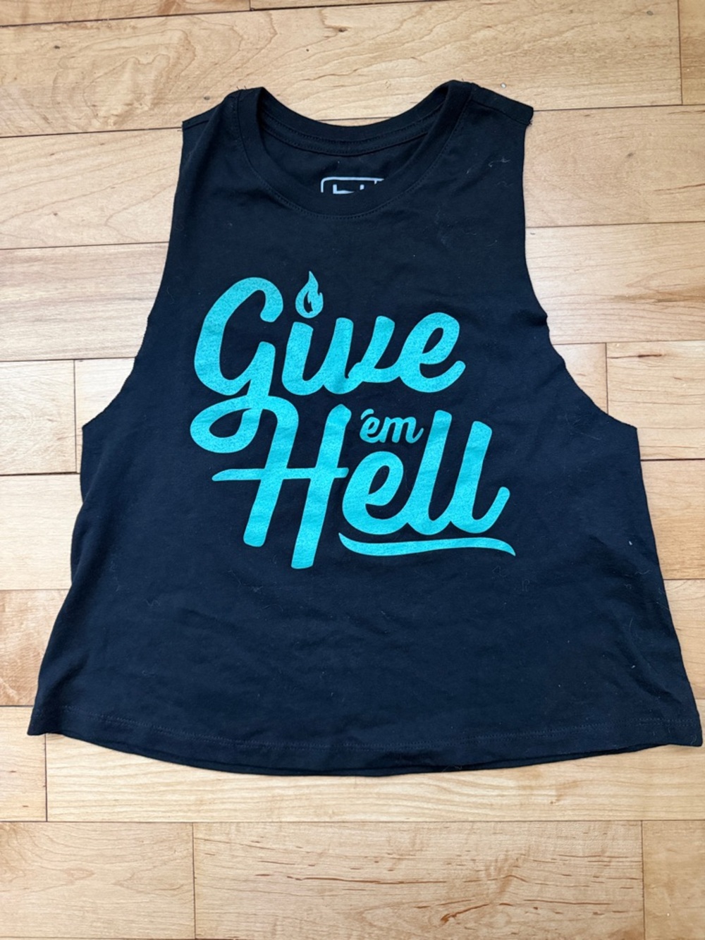 Not Dead Yet Muscle Crop Tank with Teal "Give 'em Hell" Graphic